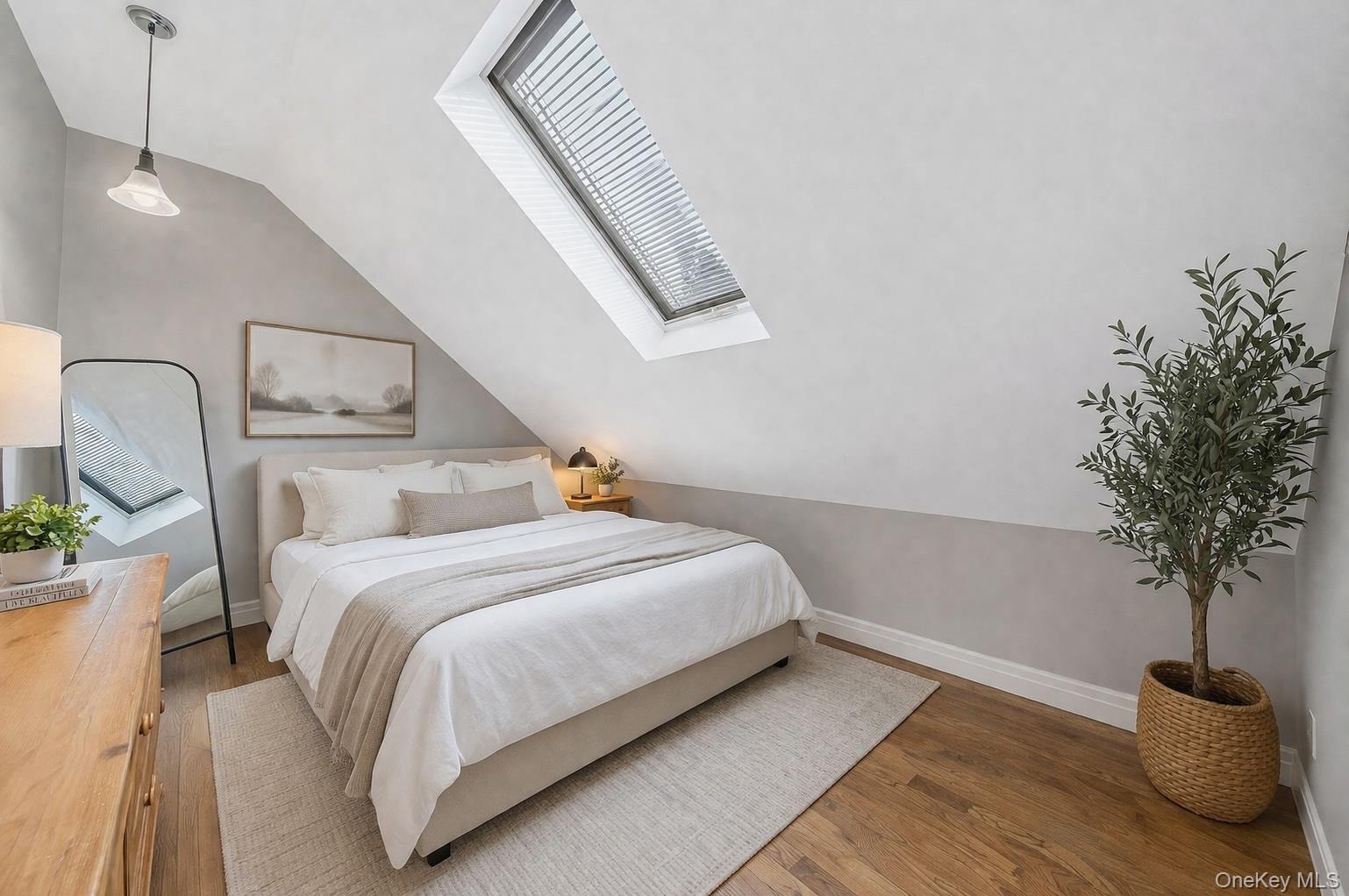 68 Fort Salonga Road Northport, NY 11768 - Photo 34 of 50 a bedroom with bed and a potted plant