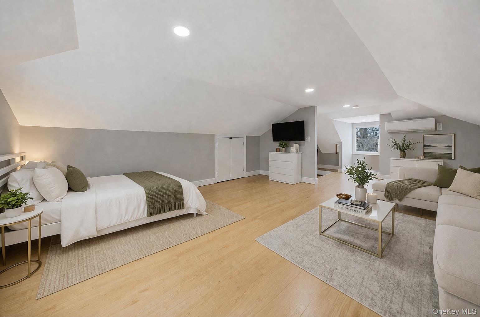 68 Fort Salonga Road Northport, NY 11768 - Photo 36 of 50 a bedroom with a bed and a couch