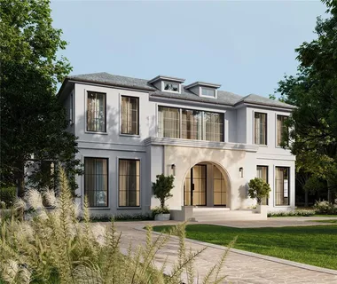 a front view of a house with a garden and plants