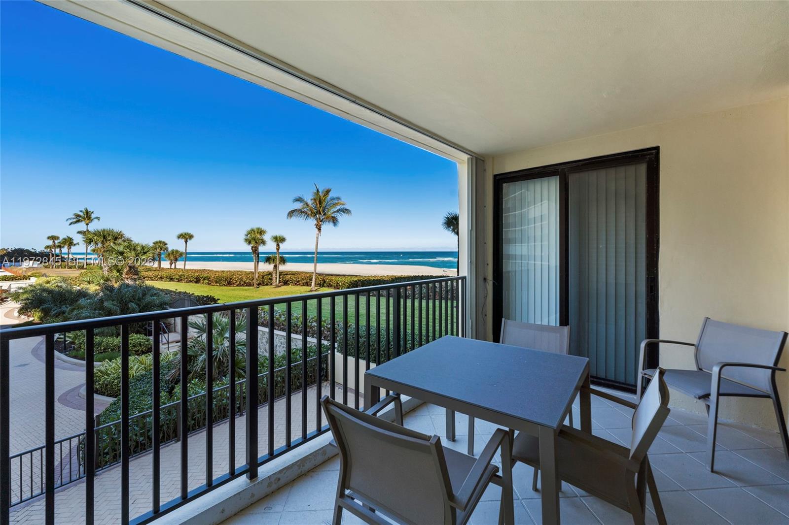 300 Ocean Trail Way, Unit 201 Jupiter, FL 33477 - Photo 6 of 15 a view of a balcony with chairs