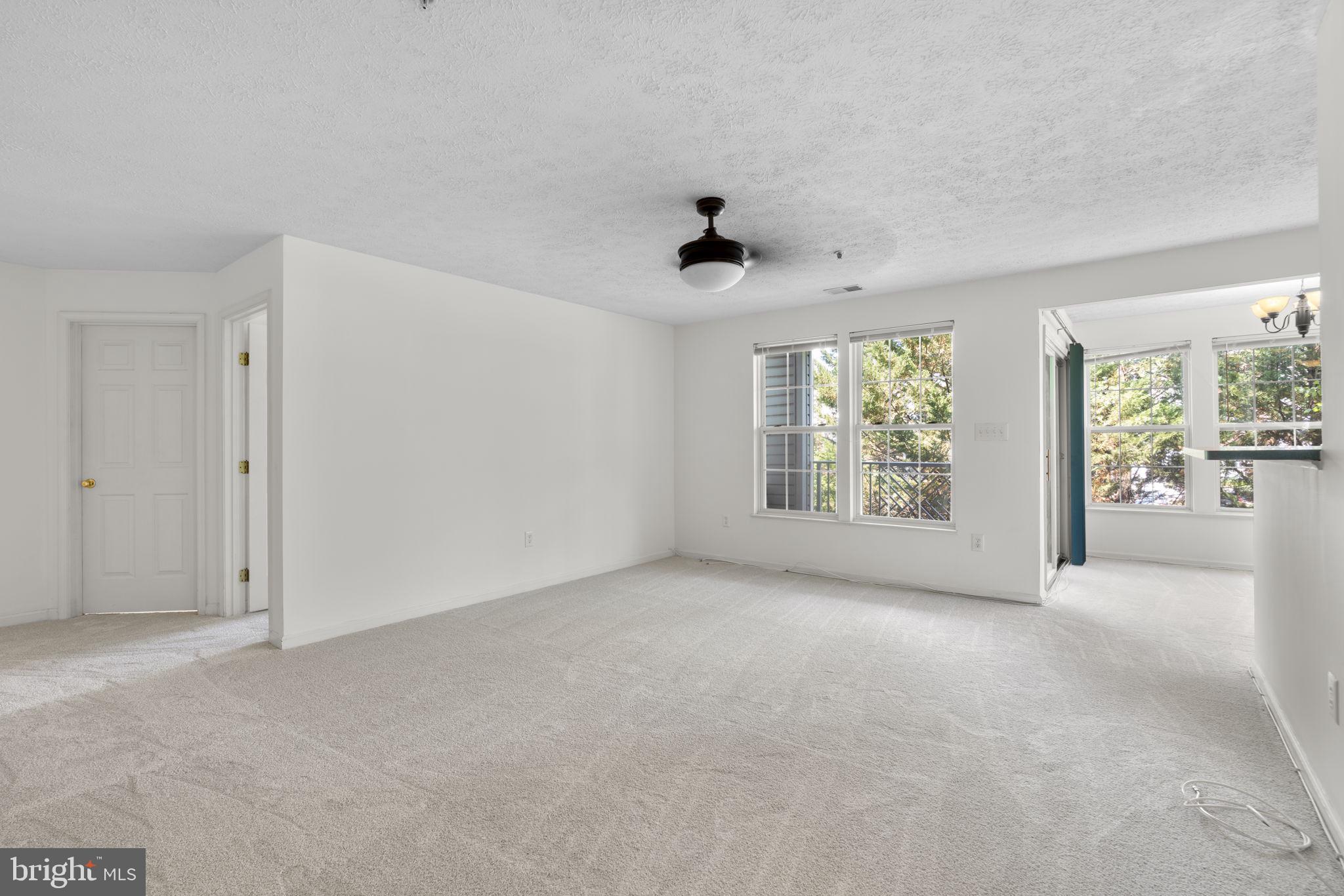 2444 Blue Spring Court, Unit 203 Odenton, MD 21113 - Photo 6 of 36 an empty room with windows and view