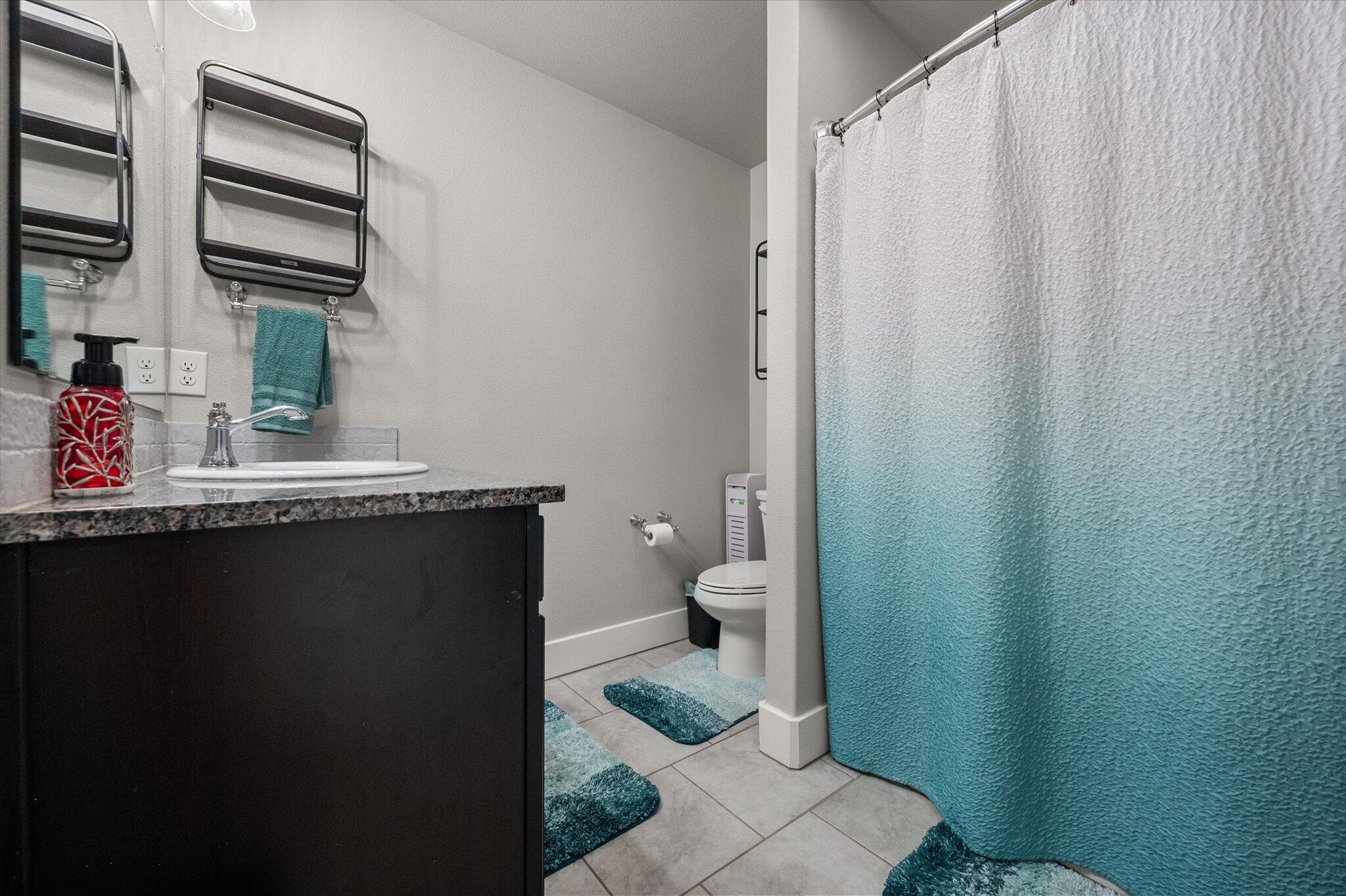 7449 31st Street Lubbock, TX 79407 - Photo 16 of 23 a bathroom with a sink and a toilet
