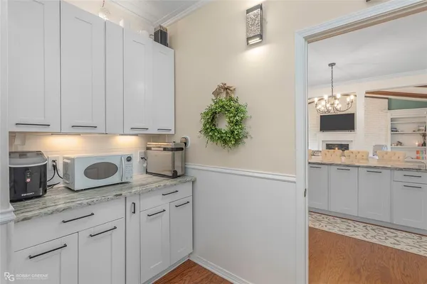 a kitchen with stainless steel appliances white cabinets and a sink