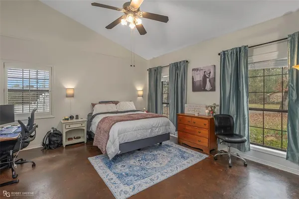 a bedroom with a bed and furniture