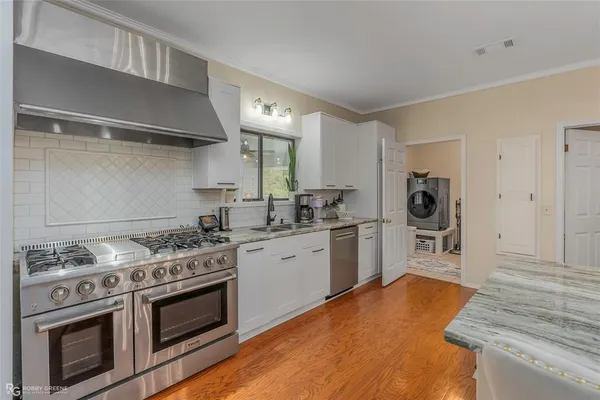 a kitchen with a stove and a refrigerator