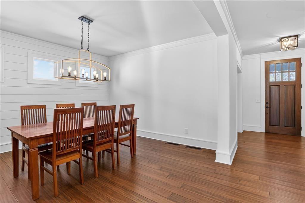 1311 Conway Road Decatur, GA 30030 - Photo 13 of 49 a view of a dining room with furniture wooden floor and chandelier