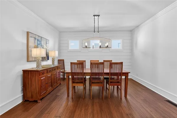 a view of dining room and wooden floor