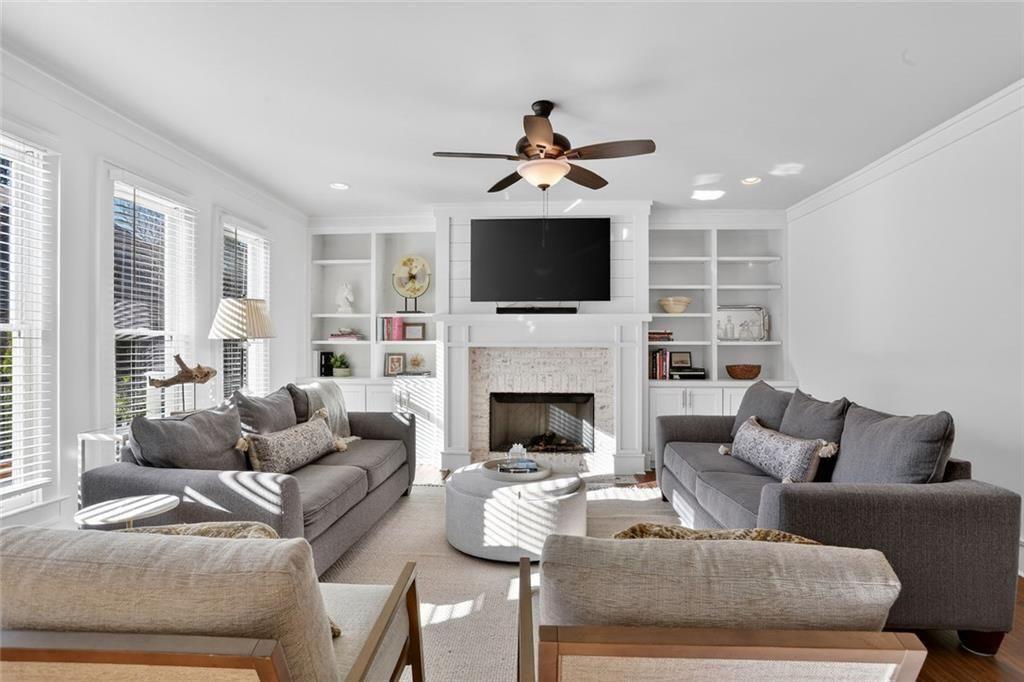 1311 Conway Road Decatur, GA 30030 - Photo 17 of 49 a living room with furniture a fireplace and a flat screen tv