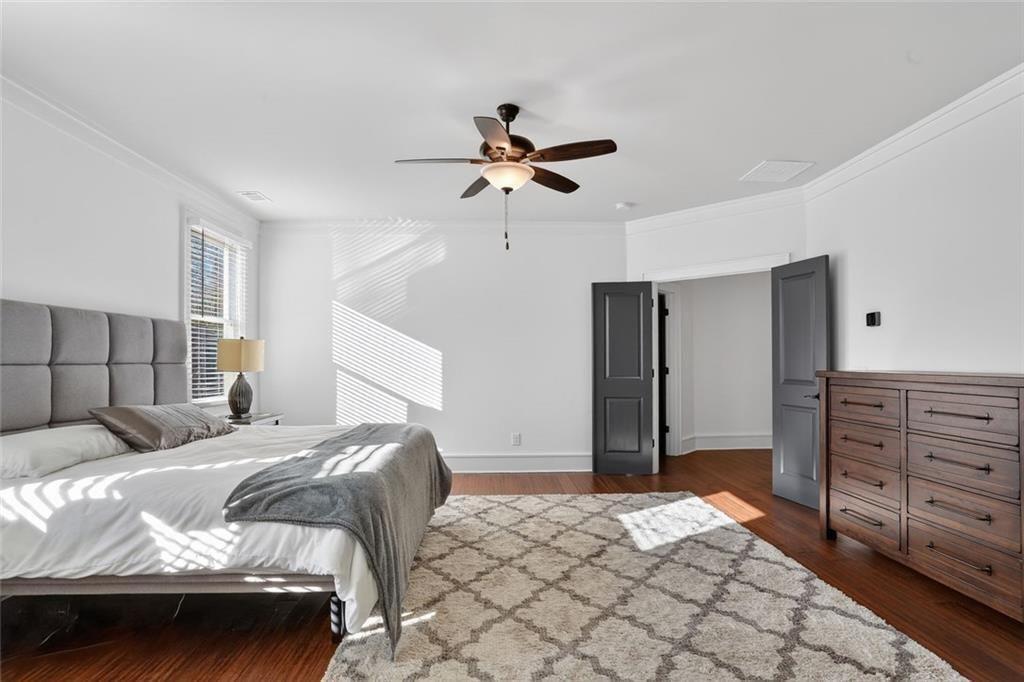 1311 Conway Road Decatur, GA 30030 - Photo 28 of 49 a bedroom with a bed and a ceiling fan