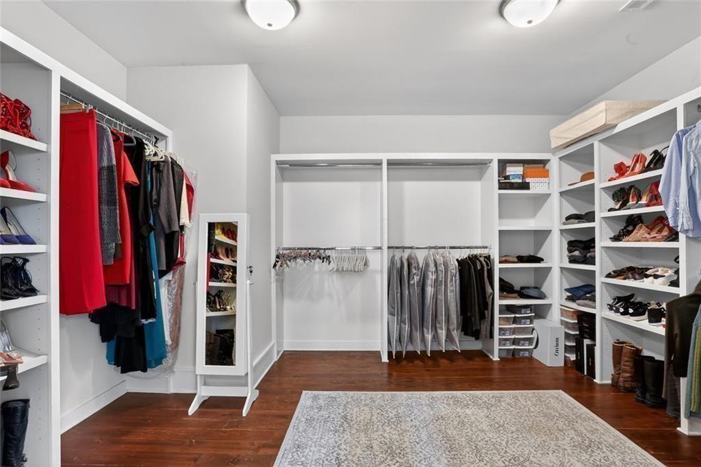 1311 Conway Road Decatur, GA 30030 - Photo 31 of 49 a view of walk in closet with clothes and shoes