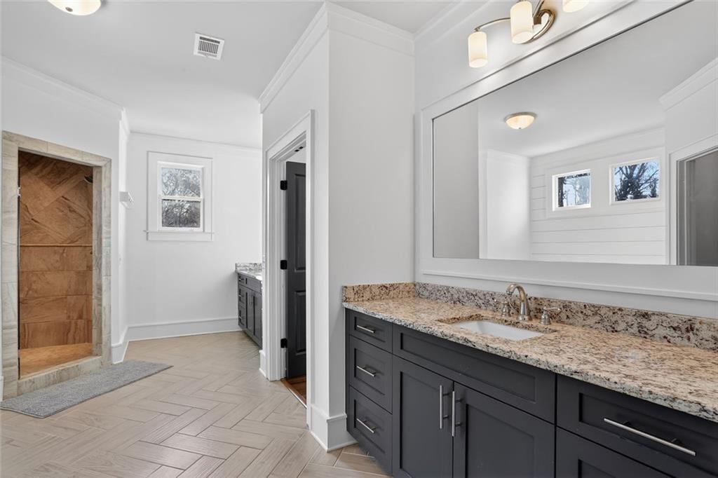 1311 Conway Road Decatur, GA 30030 - Photo 32 of 49 a bathroom with a granite countertop sink and a mirror