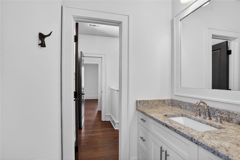 1311 Conway Road Decatur, GA 30030 - Photo 35 of 49 a bathroom with a granite countertop sink and a mirror