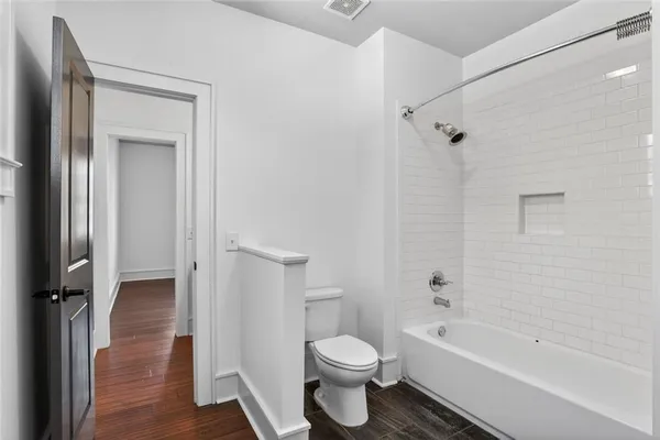 a bathroom with a toilet sink and a bathtub