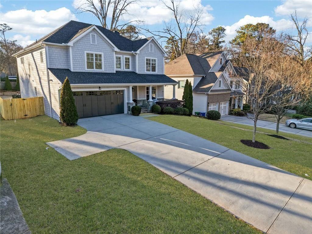 1311 Conway Road Decatur, GA 30030 - Photo 7 of 49 a front view of a house with a yard and garage