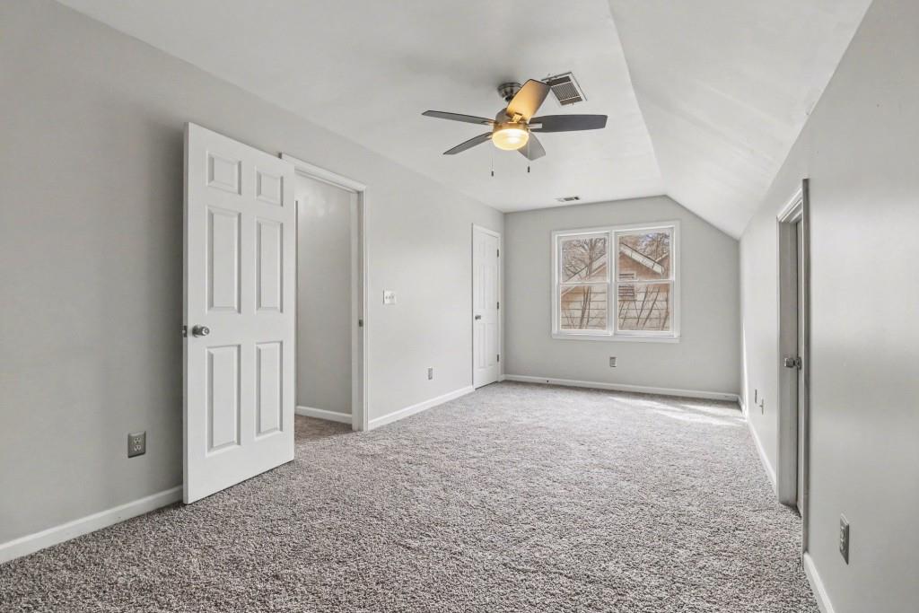 3793 Market Crescent Clarkston, GA 30021 - Photo 29 of 35 an empty room with windows and fan