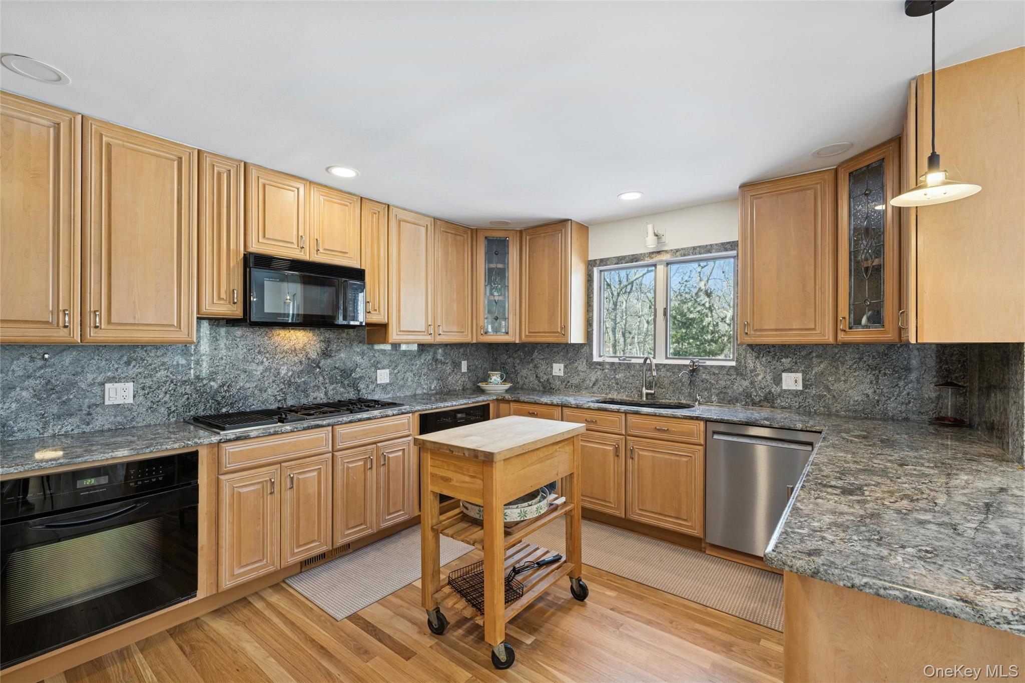 15 Rivers Road East Hampton, NY 11937 - Photo 13 of 33 a kitchen with granite countertop a sink stove and microwave