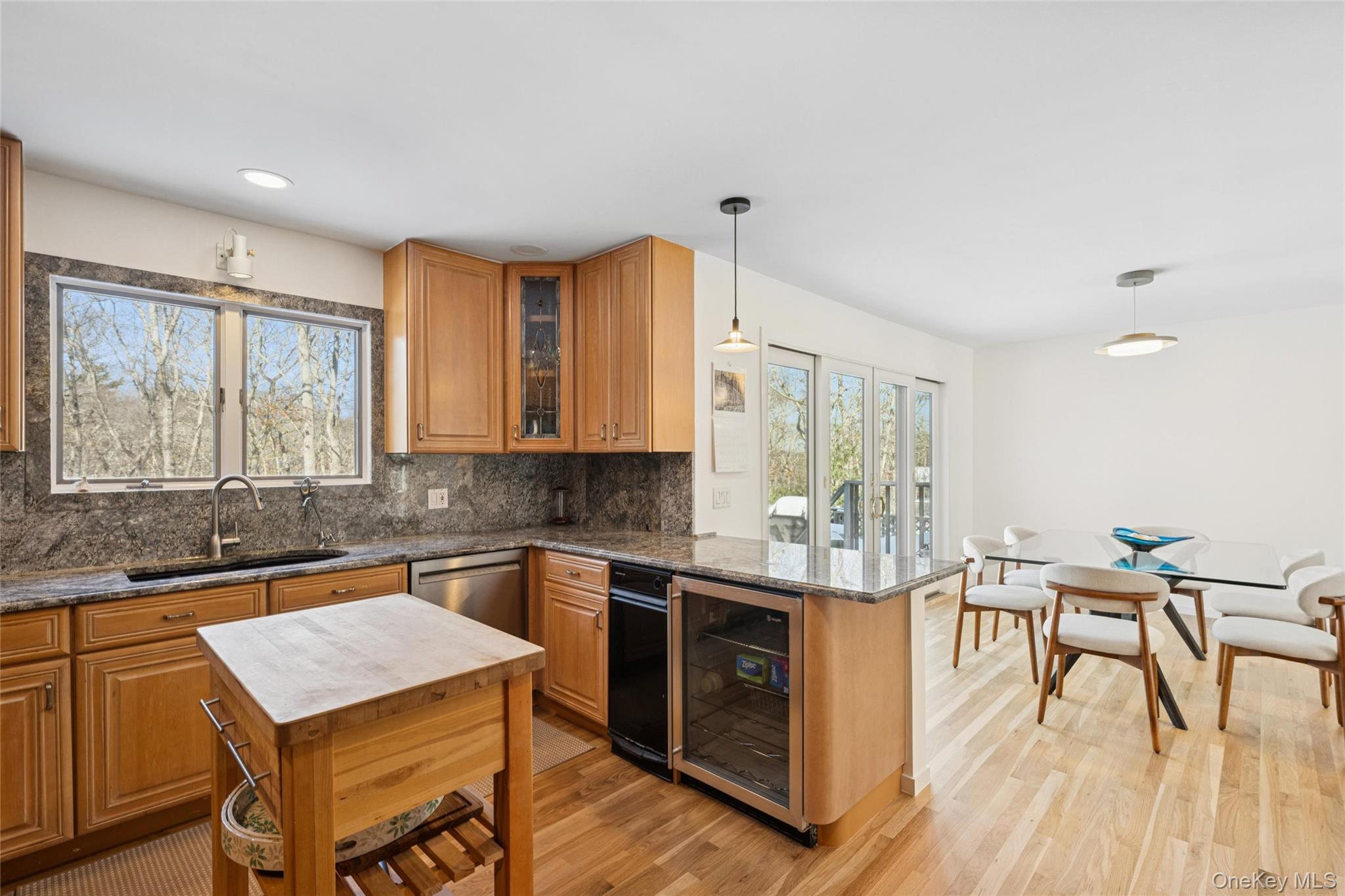 15 Rivers Road East Hampton, NY 11937 - Photo 14 of 33 a kitchen with a table chairs and wooden floor
