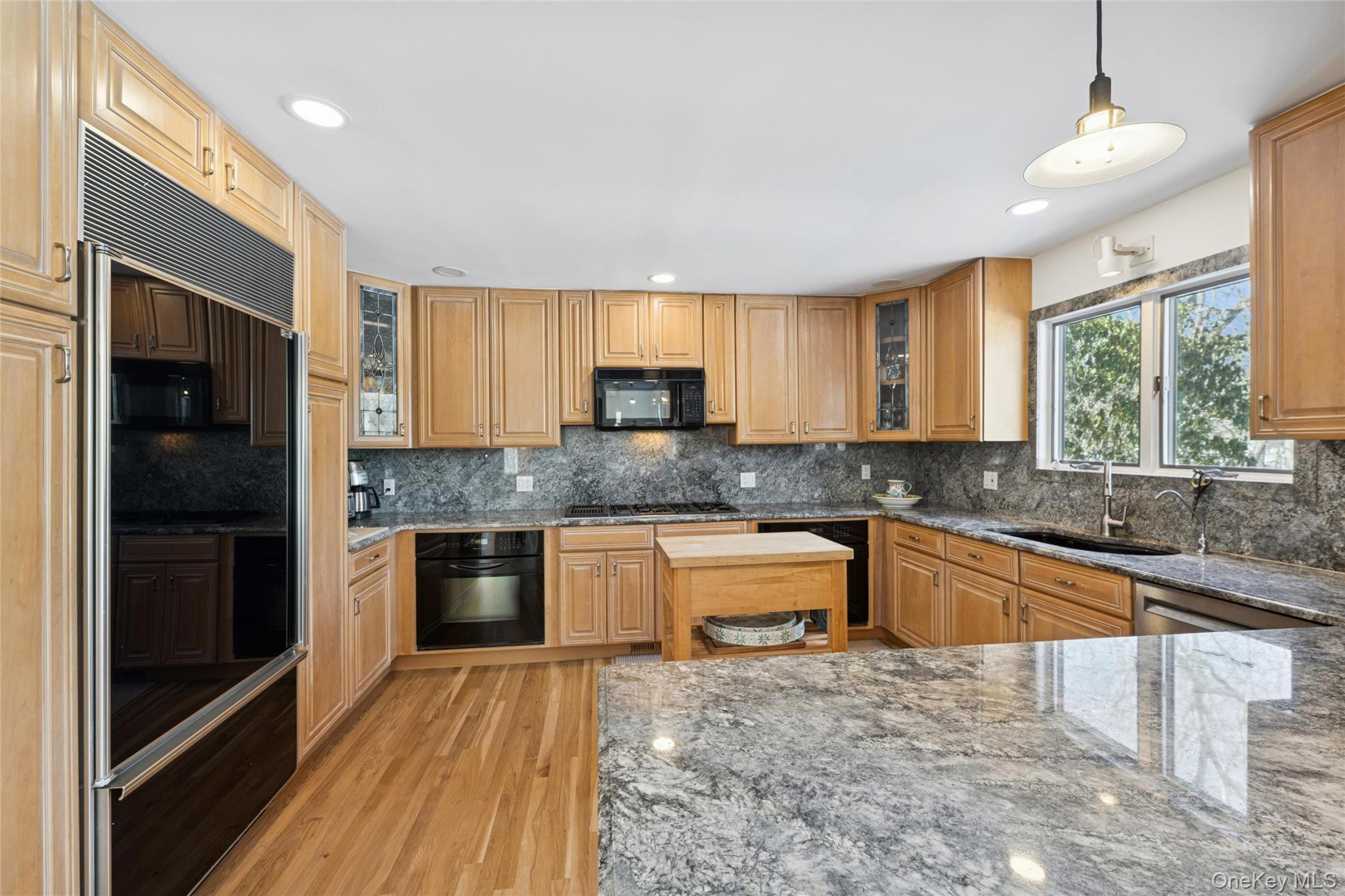 15 Rivers Road East Hampton, NY 11937 - Photo 15 of 33 a kitchen with granite countertop a stove a sink dishwasher a refrigerator and a microwave oven