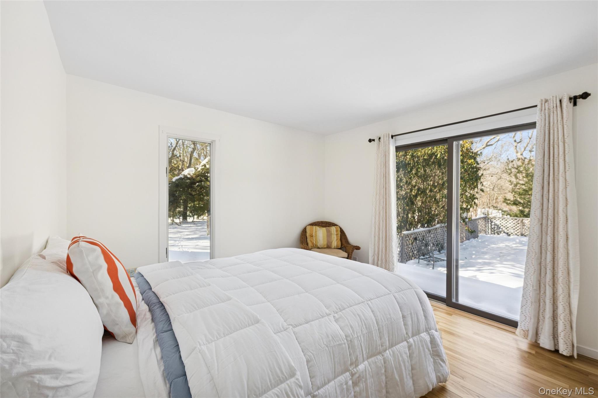 15 Rivers Road East Hampton, NY 11937 - Photo 18 of 33 a bedroom with a bed and a large window