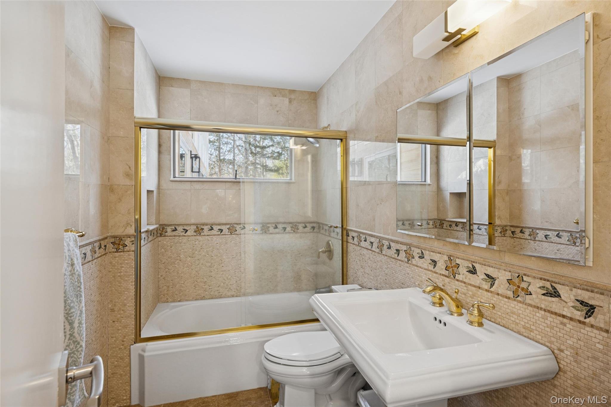 15 Rivers Road East Hampton, NY 11937 - Photo 20 of 33 a bathroom with a sink a toilet and a large mirror