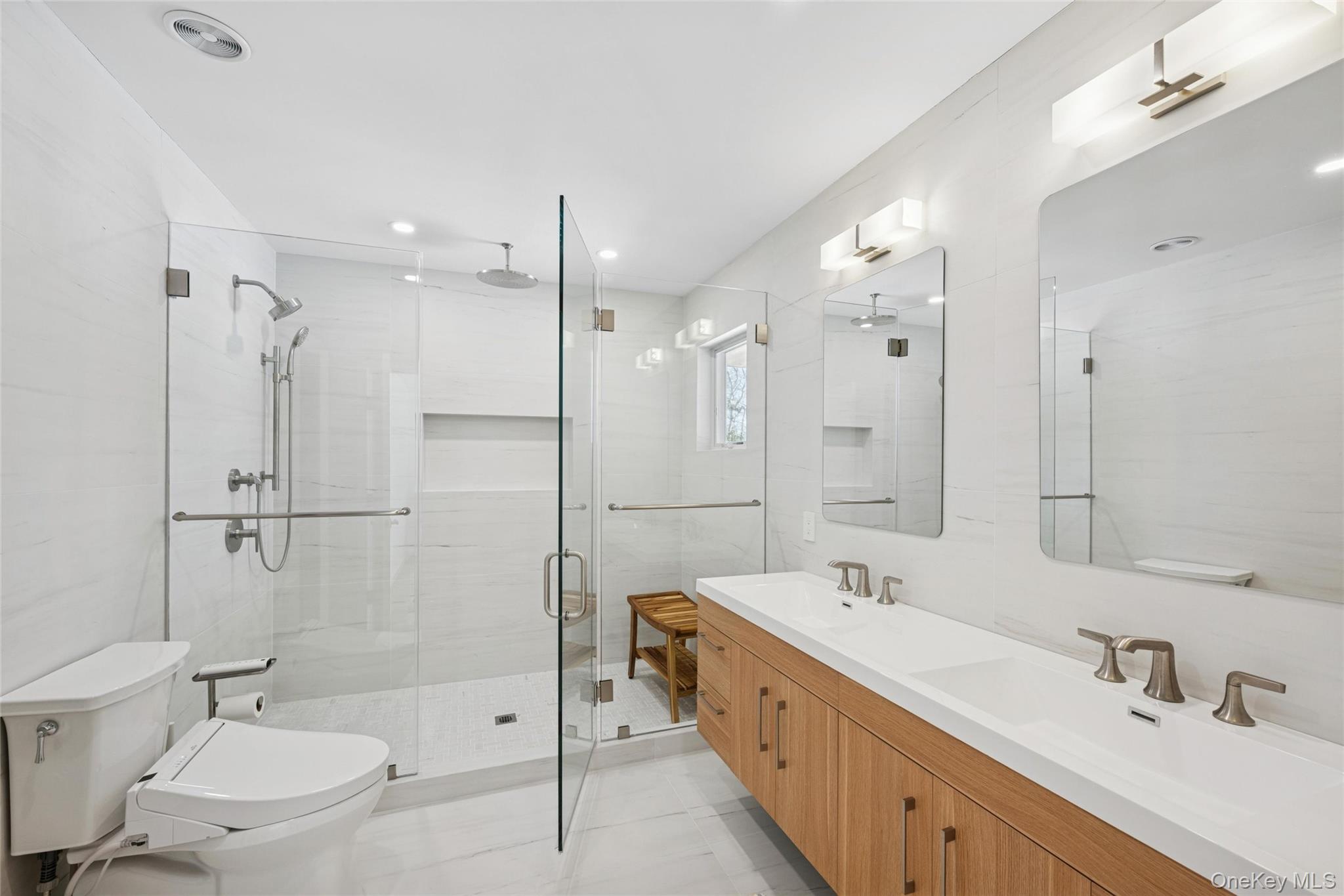 15 Rivers Road East Hampton, NY 11937 - Photo 21 of 33 a bathroom with a double vanity sink toilet mirror and shower