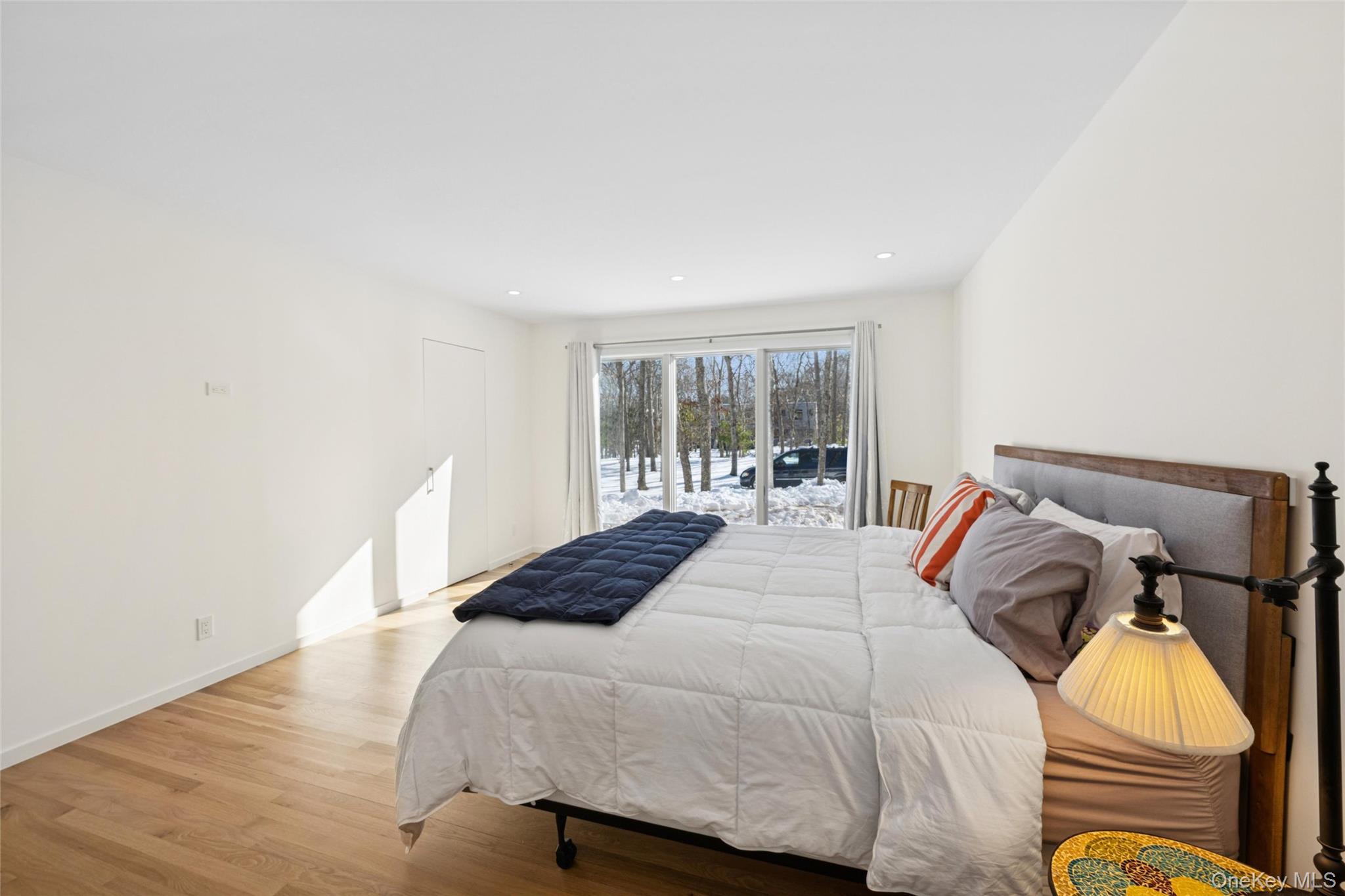 15 Rivers Road East Hampton, NY 11937 - Photo 22 of 33 a bedroom with a bed and wooden floor