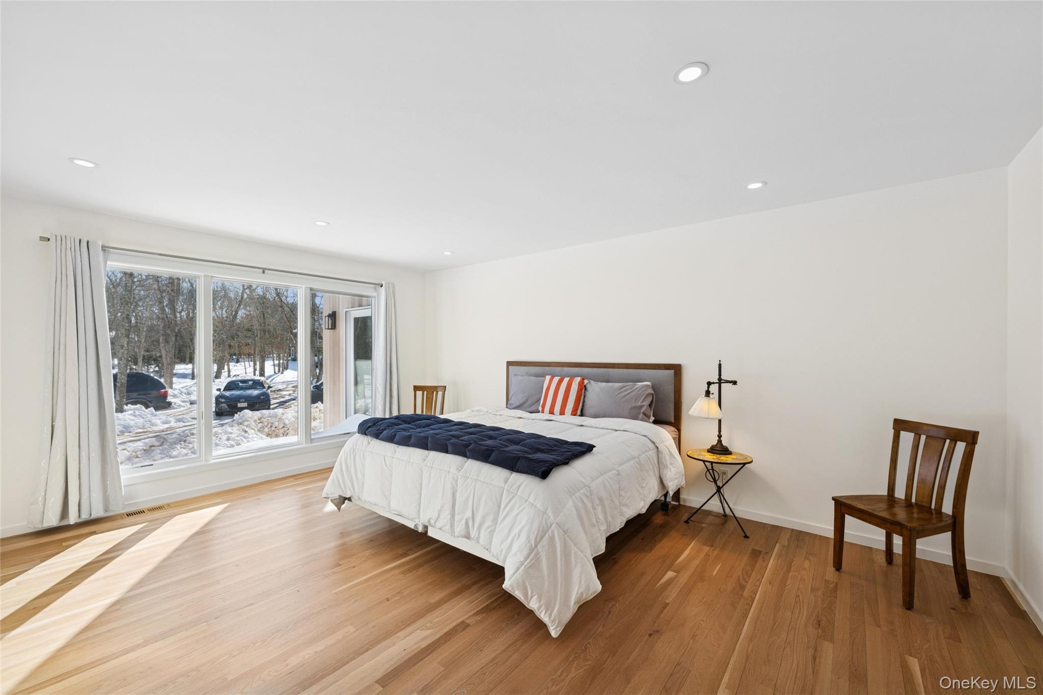 15 Rivers Road East Hampton, NY 11937 - Photo 24 of 33 a bedroom with a bed and wooden floor