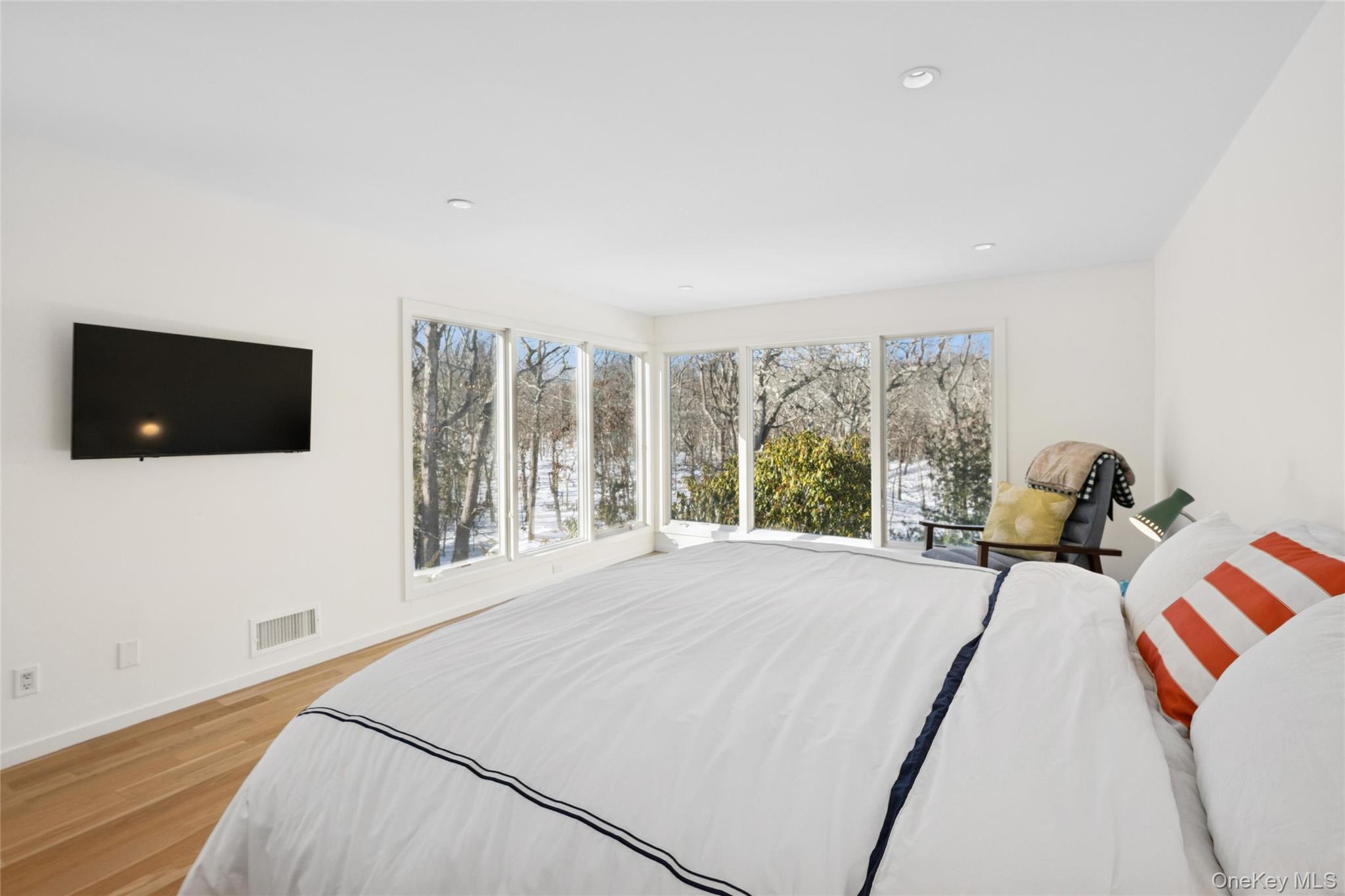 15 Rivers Road East Hampton, NY 11937 - Photo 31 of 33 a bed room with a bed a television and a large window