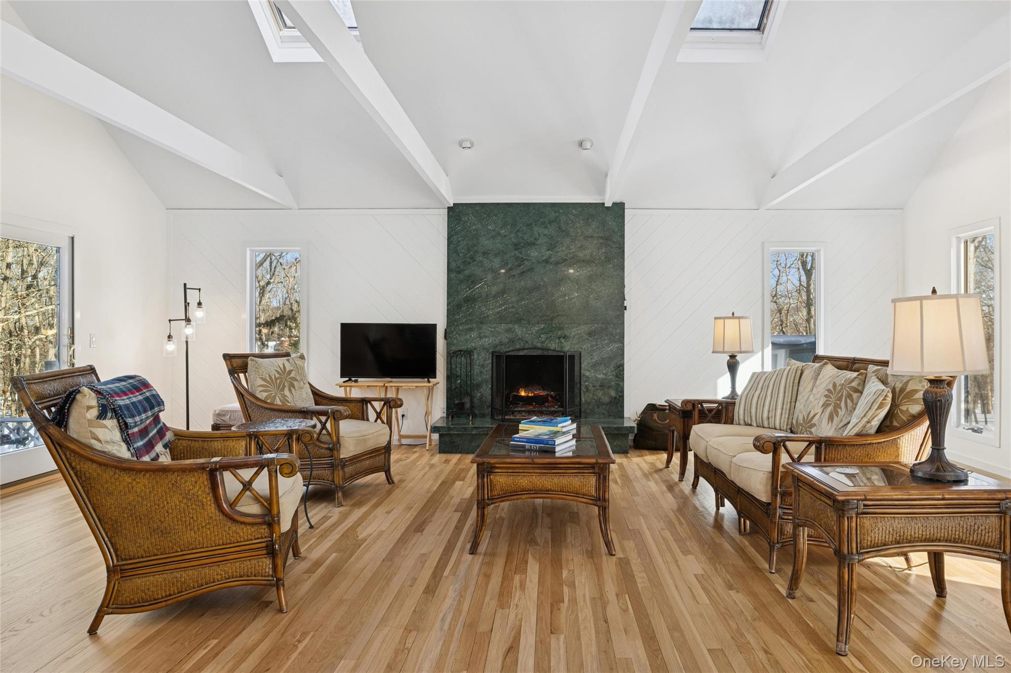 15 Rivers Road East Hampton, NY 11937 - Photo 6 of 33 a living room with furniture and a fireplace