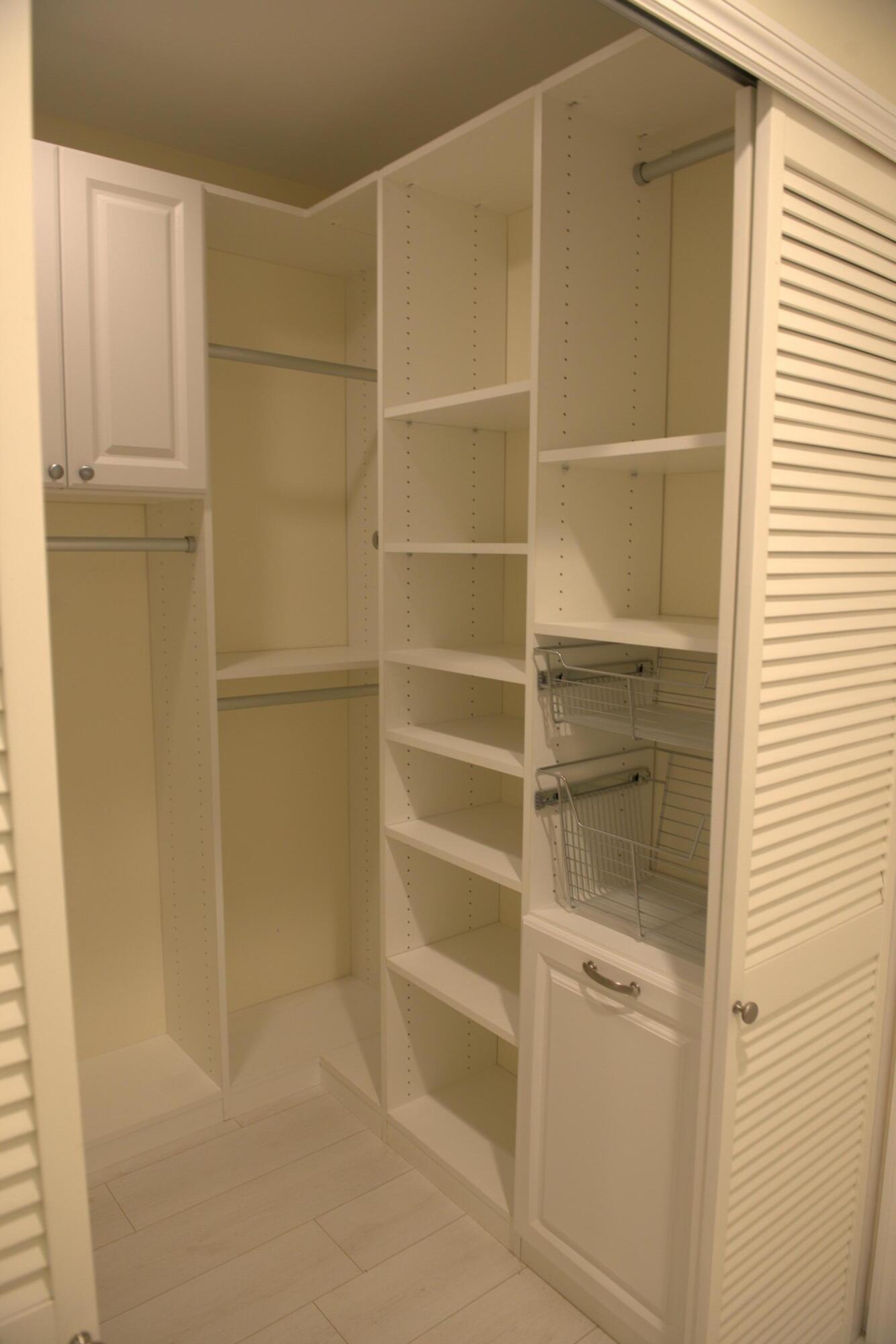 114 Beach Summit Court Jupiter, FL 33477 - Photo 16 of 32 a view of an empty walk in closet
