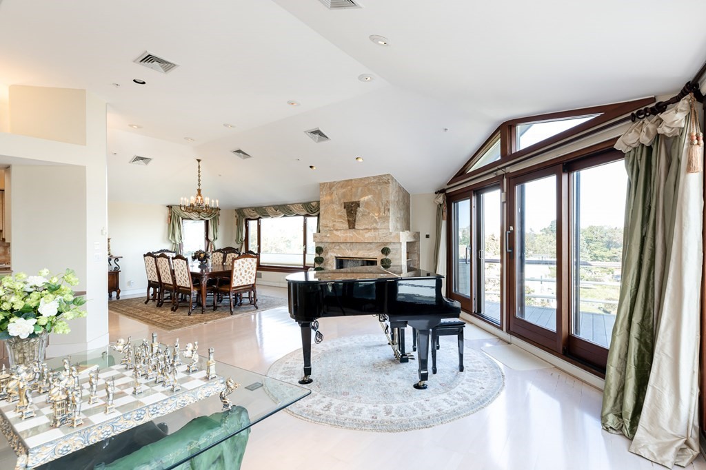 131 Nichols Road, Unit 8 Cohasset, MA 02025 - Photo 11 of 37 a living room with lots of furniture a rug and a large window