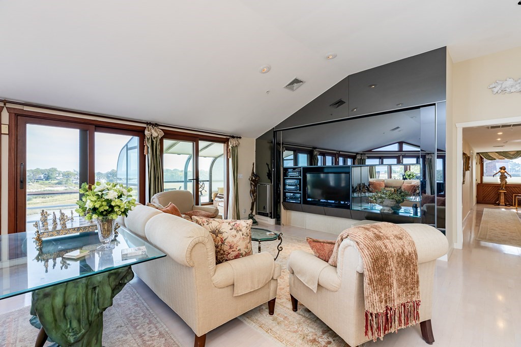 131 Nichols Road, Unit 8 Cohasset, MA 02025 - Photo 15 of 37 a living room with furniture and a large window