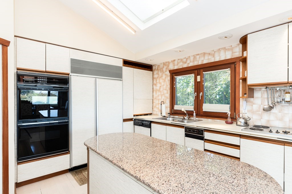 131 Nichols Road, Unit 8 Cohasset, MA 02025 - Photo 20 of 37 a kitchen with a stove a sink and a refrigerator