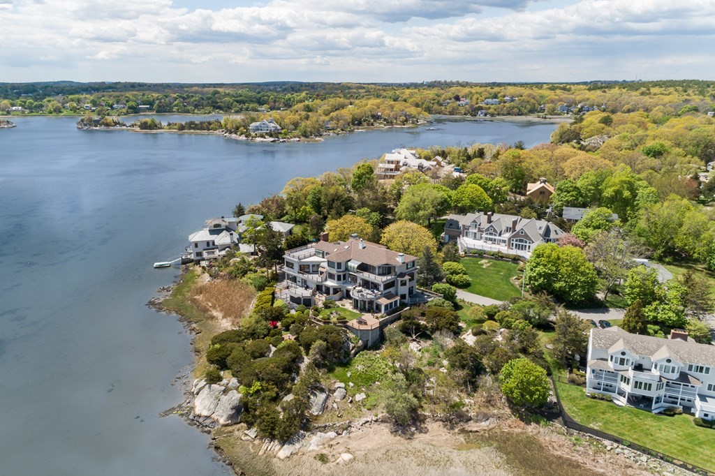 131 Nichols Road, Unit 8 Cohasset, MA 02025 - Photo 2 of 37 a view of a lake with houses