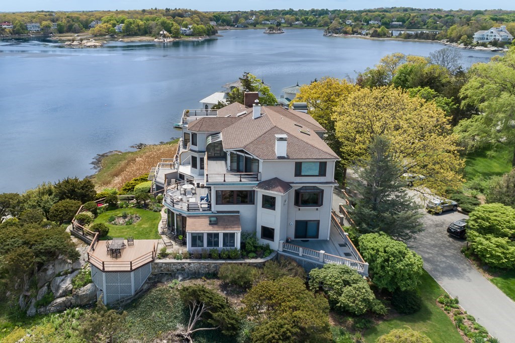 131 Nichols Road, Unit 8 Cohasset, MA 02025 - Photo 3 of 37 an aerial view of a house with outdoor space and lake view