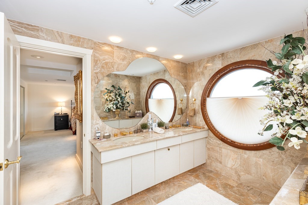 131 Nichols Road, Unit 8 Cohasset, MA 02025 - Photo 31 of 37 a bathroom with a sink and a mirror