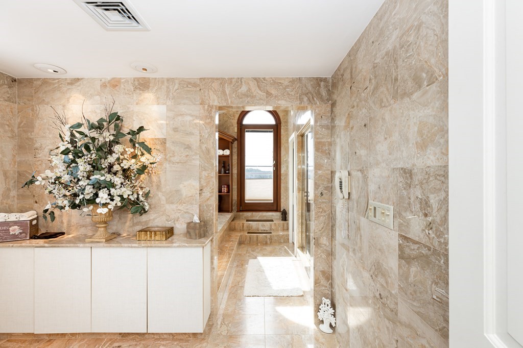 131 Nichols Road, Unit 8 Cohasset, MA 02025 - Photo 34 of 37 a bathroom with a sink and mirror