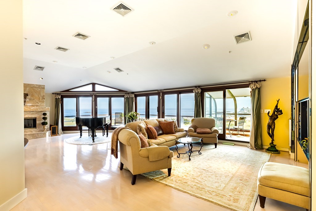 131 Nichols Road, Unit 8 Cohasset, MA 02025 - Photo 4 of 37 a living room with furniture and a large window