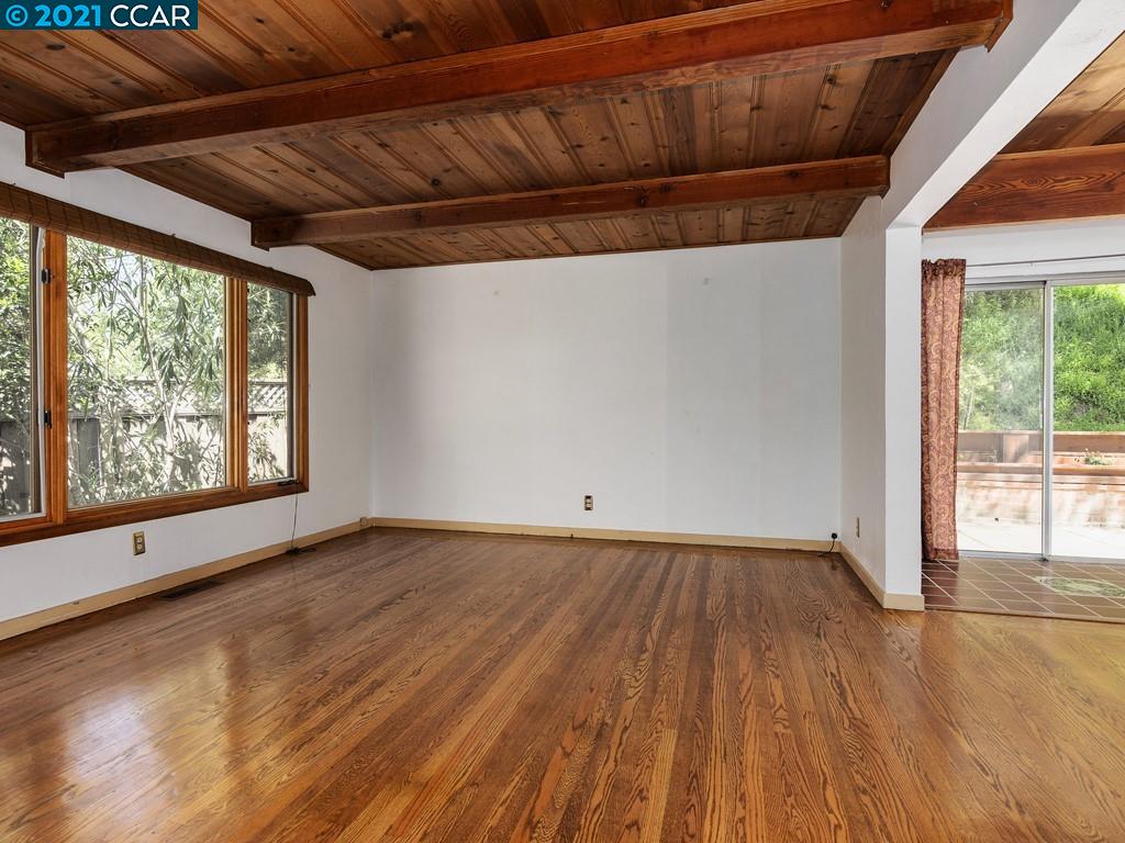 919 Janet Lane Lafayette, CA 94549 - Photo 11 of 31 a view of an empty room with wooden floor and a window