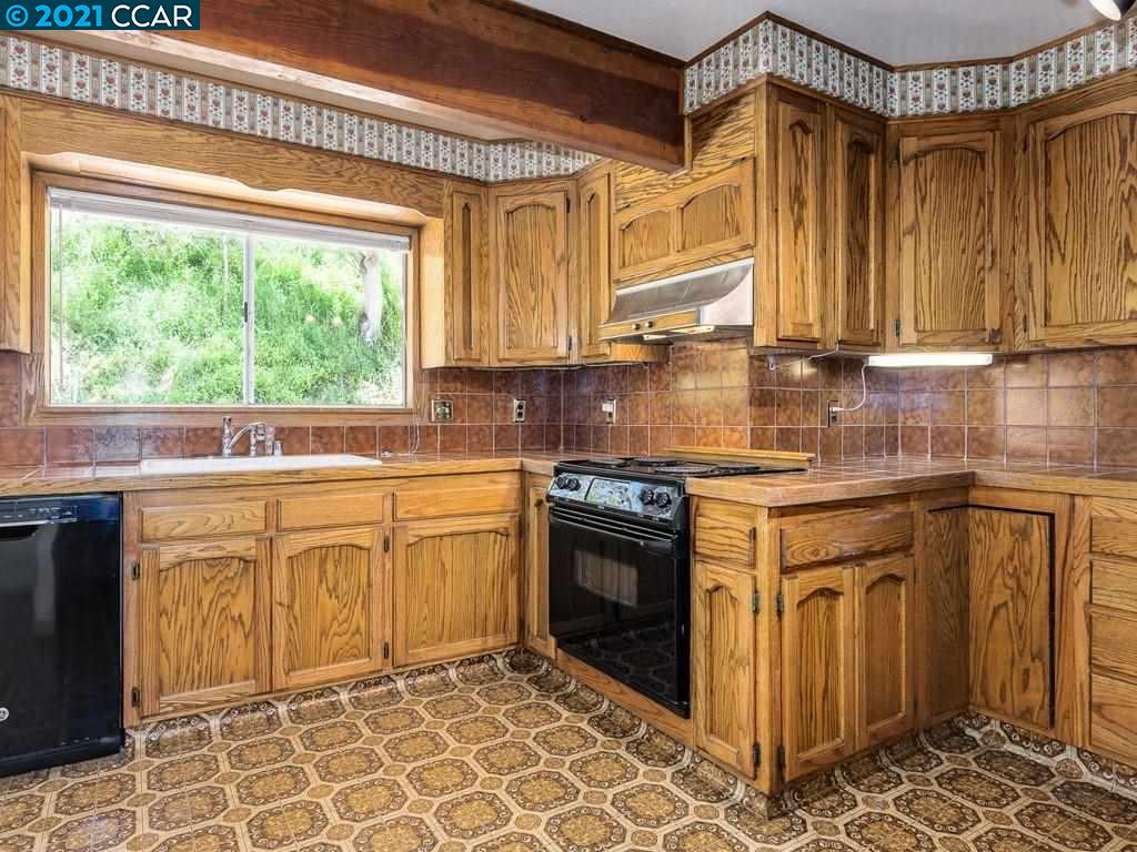 919 Janet Lane Lafayette, CA 94549 - Photo 14 of 31 a kitchen with stainless steel appliances granite countertop a stove a sink and a microwave
