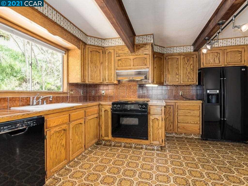 919 Janet Lane Lafayette, CA 94549 - Photo 15 of 31 a kitchen with granite countertop a stove a sink dishwasher a refrigerator and cabinets with wooden floor