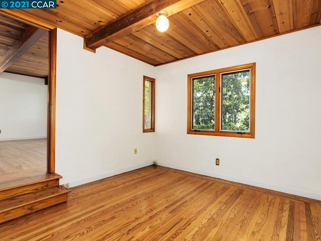 919 Janet Lane Lafayette, CA 94549 - Photo 18 of 31 a view of an empty room with wooden floor and a window