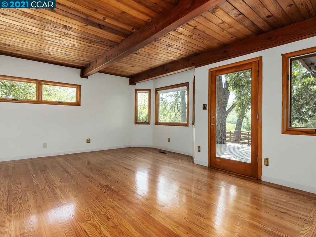 919 Janet Lane Lafayette, CA 94549 - Photo 19 of 31 a view of an empty room with wooden floor and a window