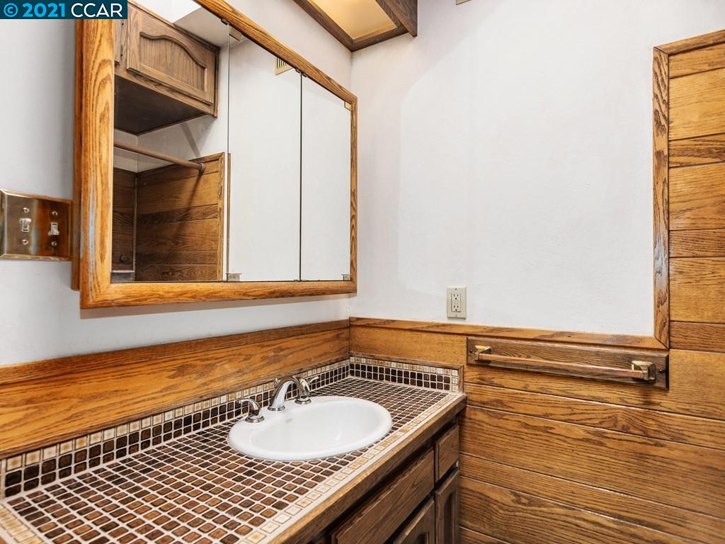 919 Janet Lane Lafayette, CA 94549 - Photo 20 of 31 a bathroom with a sink and a mirror
