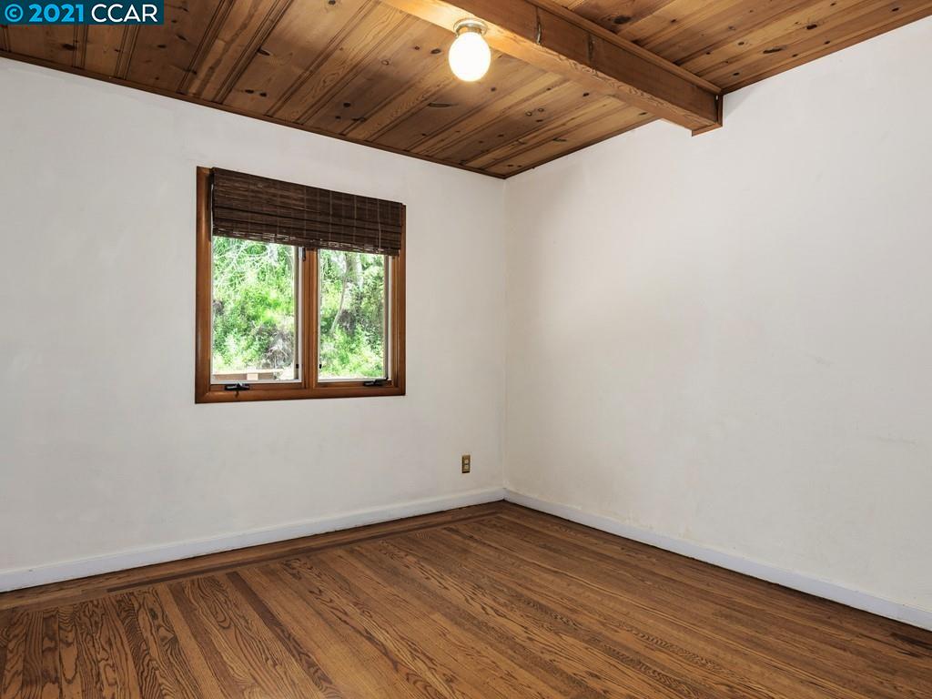 919 Janet Lane Lafayette, CA 94549 - Photo 23 of 31 a view of an empty room with wooden floor and a window
