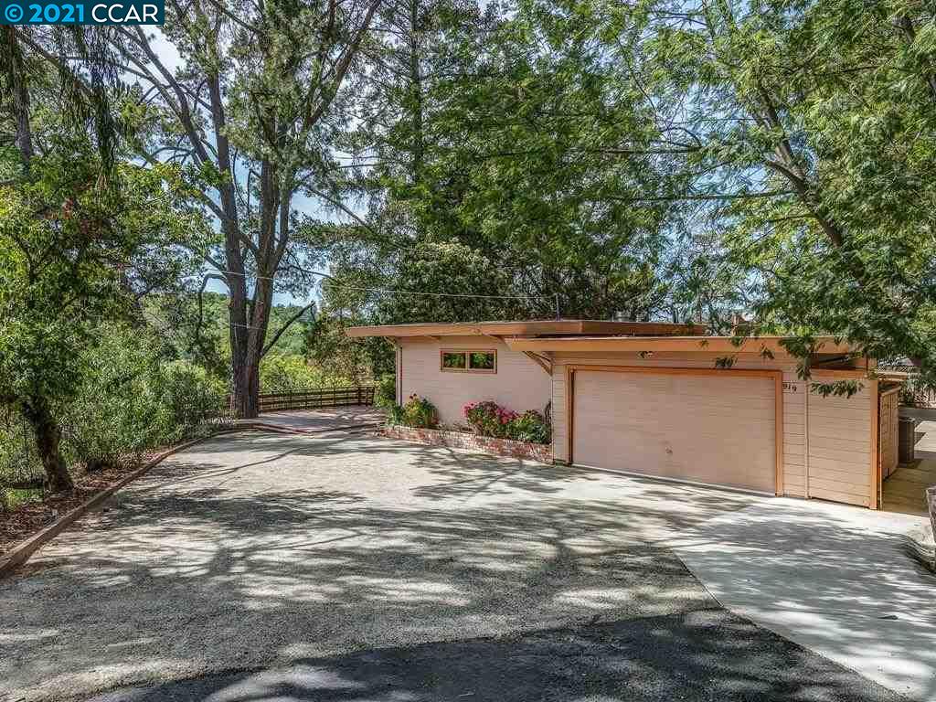 919 Janet Lane Lafayette, CA 94549 - Photo 4 of 31 front view of a house with a large tree