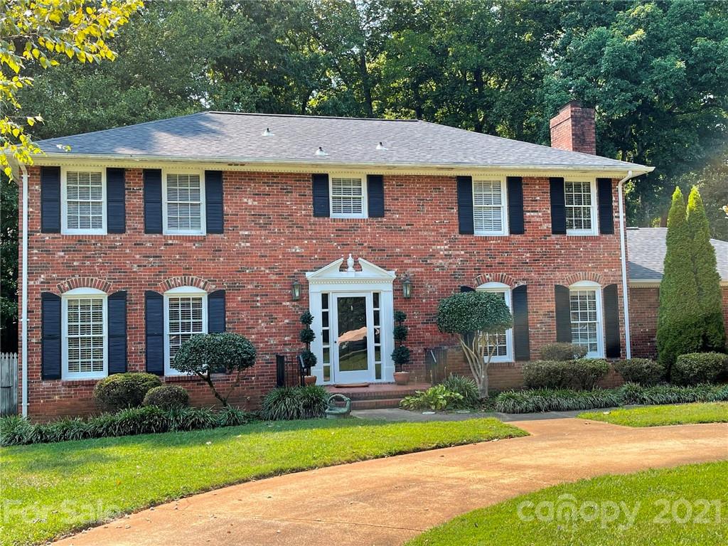 170 Nottingham Road Salisbury, NC 28147 - Photo 1 of 27 a front view of a house with a yard and trees