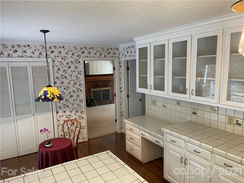 170 Nottingham Road Salisbury, NC 28147 - Photo 11 of 27 a kitchen with stainless steel appliances kitchen island granite countertop a stove a sink and a microwave
