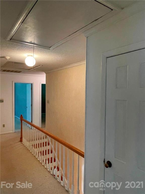 170 Nottingham Road Salisbury, NC 28147 - Photo 17 of 27 a view of staircase with lots of frames on wall and stairs