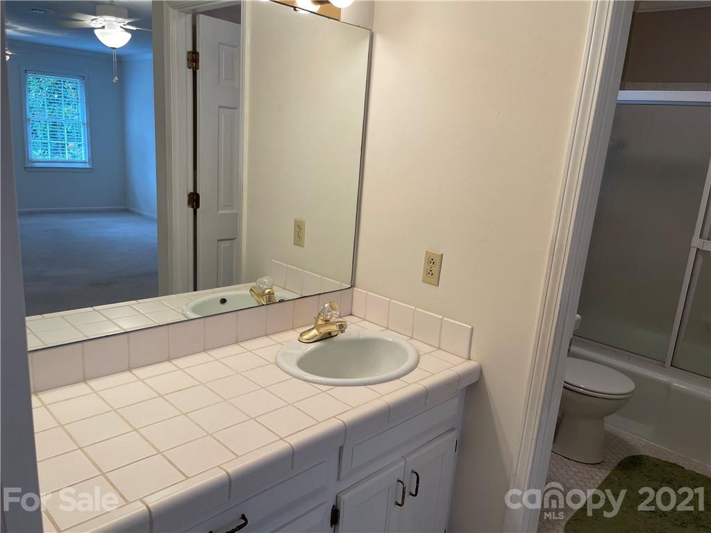 170 Nottingham Road Salisbury, NC 28147 - Photo 19 of 27 a bathroom with a sink and a mirror